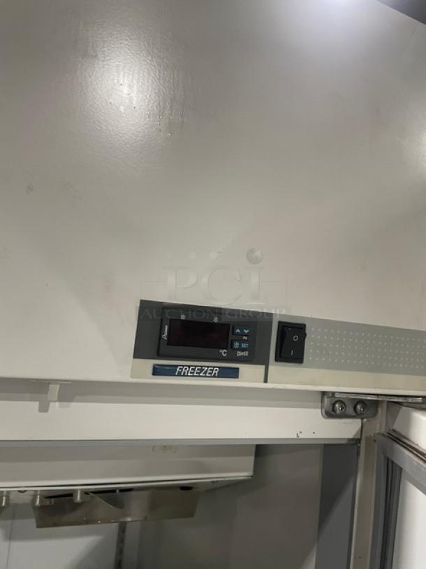 Commercial freezer with digital control panel and power switch, white surface, excellent condition. Marked "FREEZER."
