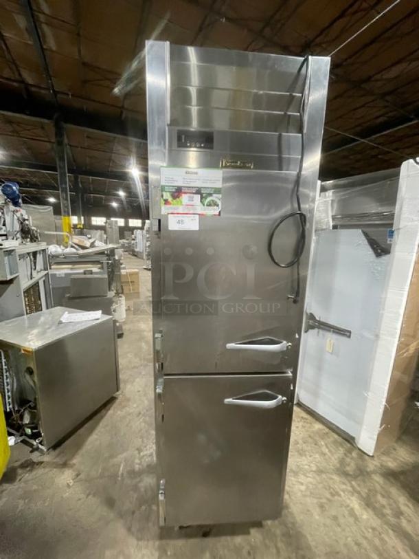 Stainless steel commercial refrigerator with dual compartments, model visible, clean condition, includes manufacturer label and auction tag.