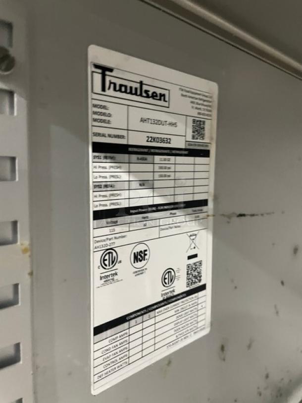 Traulsen refrigerator label, model AHT132DUT-HHS, serial 22X03632, with ETL and NSF certifications.