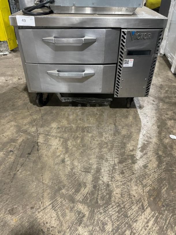 Victor refrigerated drawer unit, stainless steel, two drawers, on wheels, light wear. Label indicates brand and model.