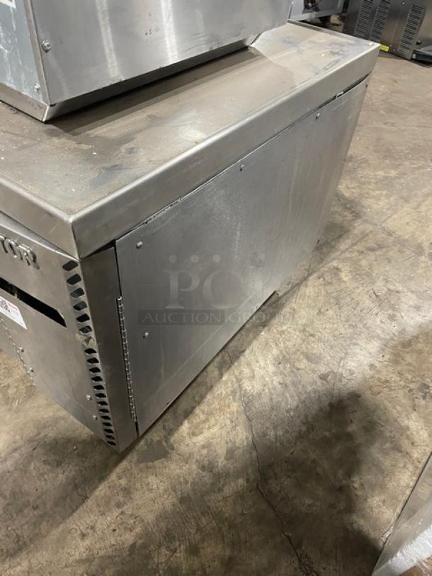 Stainless steel commercial kitchen equipment, used, with scratch marks; side vent and visible label for identifying details.