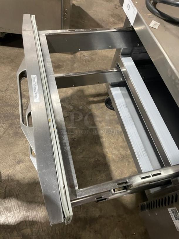 Stainless steel commercial freezer drawer, open. Label reads "TRUE TWT-93F." Excellent condition, sturdy build.