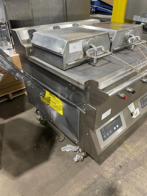 Commercial double clamshell grill in stainless steel with digital controls. Model 53. Used condition with visible wiring.