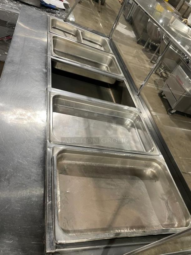 Stainless steel commercial kitchen food well unit with multiple compartments, in good condition, ideal for buffet use.