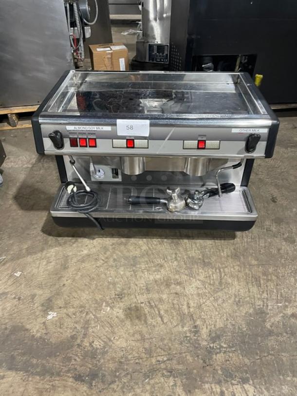 Commercial espresso machine with dual milk dispensers, labeled for almond/soy and other milk. Includes power cord and portafilter. Used condition.