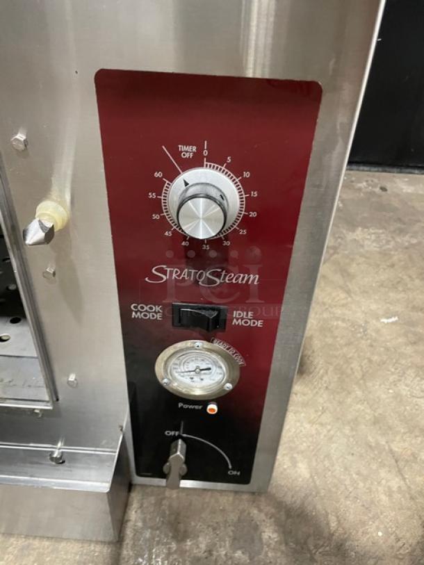 StratoSteam commercial steamer control panel with timer, cook/idle modes, and power switch. Stainless steel, good condition.