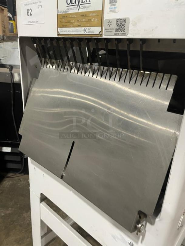 Commercial bread slicer by Oliver Products, model 777, with stainless steel blades. Condition: Used, good maintenance.