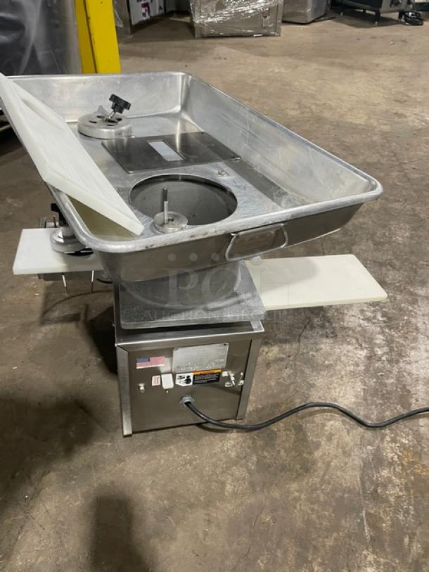 Commercial stainless steel meat mixer grinder with large tray, electric controls, and safety warning labels, in used condition.
