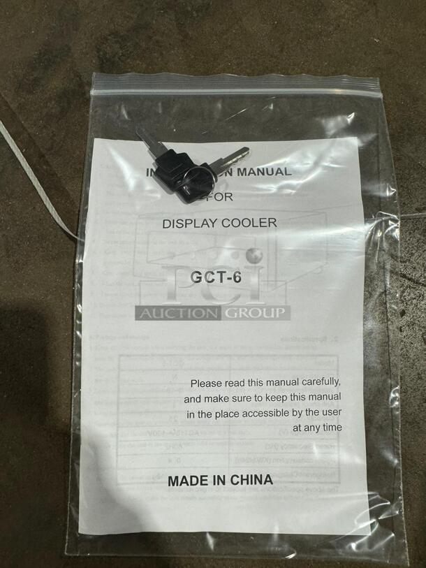 Instruction manual and keys for model GCT-6 beverage cooler, sealed in a clear plastic bag. Made in China.