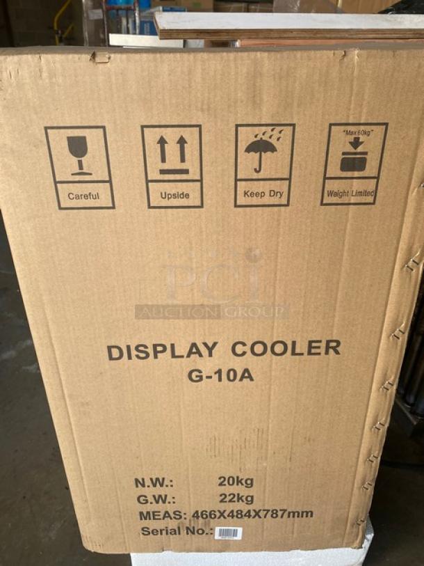 Nordon G10A Commercial Display Cooler box showing handling instructions and dimensions. Model: G-10A, serial number location visible.
