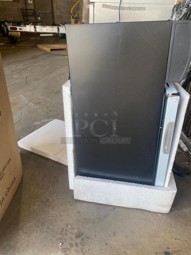 NEW Nordon G10A commercial black display cooler, scratch-n-dent condition. Features glass door, poly coated racks, lock, and keys.