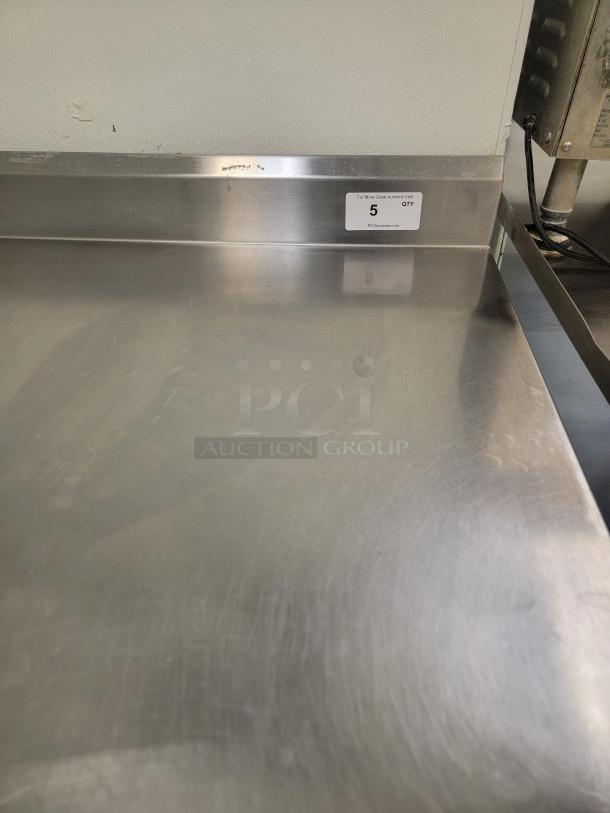 5' Stainless Workstation w/ Sink & Faucets! Looking to upgrade your prep area or add a dedicated wash station? This 5-foot Stainless Steel Workstation is a fantastic find, combining ample counter space with a built-in sink, making it incredibly versatile for a variety of settings! *BUYER MUST REMOVE - NO SHIPPING OR HANDLING AVAILABLE* - Image 3 of 4