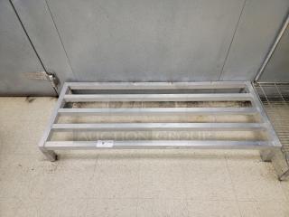 (2) New Age 5' 2020 Low Profile Dunnage Rack - Elevate Your Storage! Need to store items off the floor to meet health codes or prevent damage? This New Age 5-foot 2020 Low Profile Dunnage Rack is the perfect solution for organized, sanitary, and compliant storage!

Ideal for commercial kitchens, warehouses, dry storage areas, and more. Keep your valuable inventory safe and accessible while meeting critical sanitation requirements. *BUYER MUST REMOVE - NO SHIPPING OR HANDLING AVAILABLE*