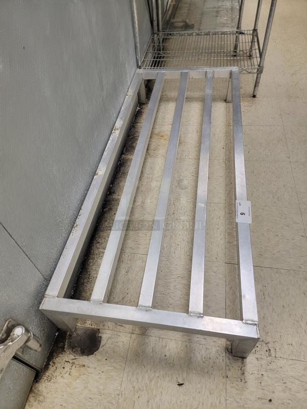 (2) New Age 5' 2020 Low Profile Dunnage Rack - Elevate Your Storage! Need to store items off the floor to meet health codes or prevent damage? This New Age 5-foot 2020 Low Profile Dunnage Rack is the perfect solution for organized, sanitary, and compliant storage!

Ideal for commercial kitchens, warehouses, dry storage areas, and more. Keep your valuable inventory safe and accessible while meeting critical sanitation requirements. *BUYER MUST REMOVE - NO SHIPPING OR HANDLING AVAILABLE* - Image 2 of 3