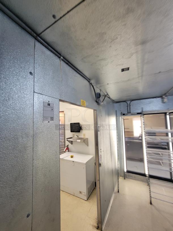 Imperial Super Insulated 18' Walk-in Cooler with 3 Glass Door Pass-Through & Bonus Shelving! Massive cold storage and display solution available! We're offering a fantastic deal on a 18-foot Imperial Super Insulated Walk-in Cooler, featuring a convenient 3-Glass Door Pass-Through for easy merchandising and access. Heatcraft MOHO25 Outdoor/Rooftop condensing unit.  As a special bonus, this package includes Metro Racks and additional shelving to get you organized right away! - *BUYER MUST DISASSEMBLE AND REMOVE - NO SHIPPING OR HANDLING AVAILABLE* - Image 11 of 20
