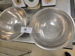 (2) 14" Stainless Steel Colanders - Essential Kitchen Tools! Upgrade your kitchen with these versatile and durable colanders, perfect for draining pasta, rinsing fruits and vegetables, straining stocks, and much more. An indispensable item for any home cook or commercial kitchen! *BUYER MUST REMOVE - NO SHIPPING OR HANDLING AVAILABLE*