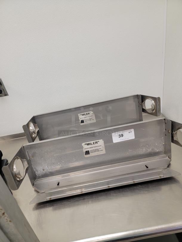 (2) Miler Stainless Steel Speedwrap Dispensers - Ultimate Efficiency for Your Kitchen! Tired of struggling with plastic wrap and foil? Stainless Steel Dispensers are the ultimate tool for quick, easy, and frustration-free dispensing of food wrap, foil, or parchment paper. These are a game-changer for any busy commercial kitchen, catering business, or even the serious home chef! *BUYER MUST REMOVE - NO SHIPPING OR HANDLING AVAILABLE* - Image 1 of 3