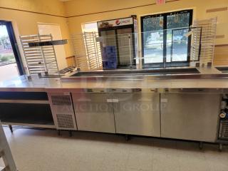 Randell 18-Foot Refrigerated Prep Table with Cold Food Wells - Massive Capacity! Revolutionize your kitchen's prep and cold storage! We're offering an impressive 18-foot Randell Refrigerated Prep Table with integrated Cold Food Wells, the ultimate solution for high-volume sandwich, salad, pizza, or assembly lines. This is a must-have for large restaurants, delis, catering operations, or institutional kitchens that demand efficiency and ample refrigerated storage. *BUYER MUST REMOVE - NO SHIPPING OR HANDLING AVAILABLE* - Item #1192738