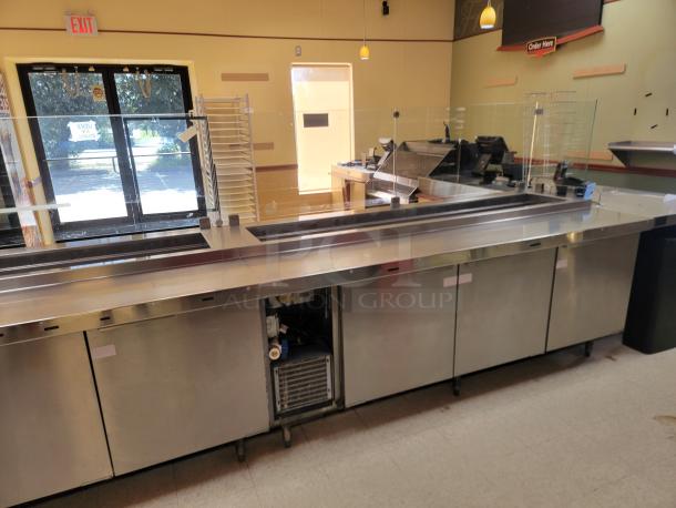Randell 18-Foot Refrigerated Prep Table with Cold Food Wells - Massive Capacity! Revolutionize your kitchen's prep and cold storage! We're offering an impressive 18-foot Randell Refrigerated Prep Table with integrated Cold Food Wells, the ultimate solution for high-volume sandwich, salad, pizza, or assembly lines. This is a must-have for large restaurants, delis, catering operations, or institutional kitchens that demand efficiency and ample refrigerated storage. *BUYER MUST REMOVE - NO SHIPPING OR HANDLING AVAILABLE* - Image 2 of 15