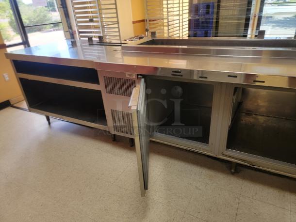Randell 18-Foot Refrigerated Prep Table with Cold Food Wells - Massive Capacity! Revolutionize your kitchen's prep and cold storage! We're offering an impressive 18-foot Randell Refrigerated Prep Table with integrated Cold Food Wells, the ultimate solution for high-volume sandwich, salad, pizza, or assembly lines. This is a must-have for large restaurants, delis, catering operations, or institutional kitchens that demand efficiency and ample refrigerated storage. *BUYER MUST REMOVE - NO SHIPPING OR HANDLING AVAILABLE* - Image 3 of 15