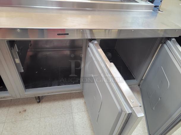 Randell 18-Foot Refrigerated Prep Table with Cold Food Wells - Massive Capacity! Revolutionize your kitchen's prep and cold storage! We're offering an impressive 18-foot Randell Refrigerated Prep Table with integrated Cold Food Wells, the ultimate solution for high-volume sandwich, salad, pizza, or assembly lines. This is a must-have for large restaurants, delis, catering operations, or institutional kitchens that demand efficiency and ample refrigerated storage. *BUYER MUST REMOVE - NO SHIPPING OR HANDLING AVAILABLE* - Image 6 of 15