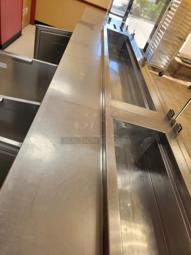 Randell 18-Foot Refrigerated Prep Table with Cold Food Wells - Massive Capacity! Revolutionize your kitchen's prep and cold storage! We're offering an impressive 18-foot Randell Refrigerated Prep Table with integrated Cold Food Wells, the ultimate solution for high-volume sandwich, salad, pizza, or assembly lines. This is a must-have for large restaurants, delis, catering operations, or institutional kitchens that demand efficiency and ample refrigerated storage. *BUYER MUST REMOVE - NO SHIPPING OR HANDLING AVAILABLE* - Image 8 of 15