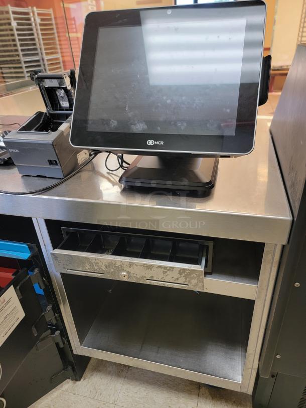 90" Stainless Steel POS Workstation with NCR Setup! Streamline your point-of-sale operations! We're offering a robust 90-inch Stainless Steel POS Workstation complete with BONUS NCR Equipment, providing a ready-to-use solution for your restaurant, retail store, or quick-service establishment. This integrated setup combines durability with leading POS technology. *BUYER MUST REMOVE - NO SHIPPING OR HANDLING AVAILABLE* - Image 3 of 5