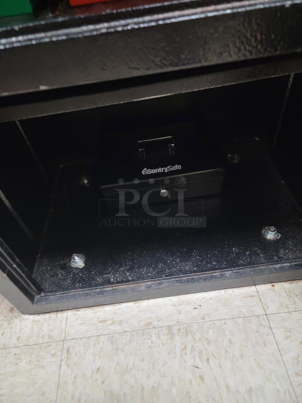 Cennox Drop Drawer Commercial Grade Under-Counter Deposit Safe - Secure Your Cash! Enhance your cash management and security! We're offering a robust Cennox Commercial Grade Under-Counter Drop Drawer Safe, a vital tool for businesses needing to secure cash, checks, or sensitive documents throughout the day. This unit combines a secure top drop with a spacious bottom compartment for reliable protection. *Combinations will be provided to the winning bidder* *BUYER MUST REMOVE - NO SHIPPING OR HANDLING AVAILABLE* - Image 3 of 4