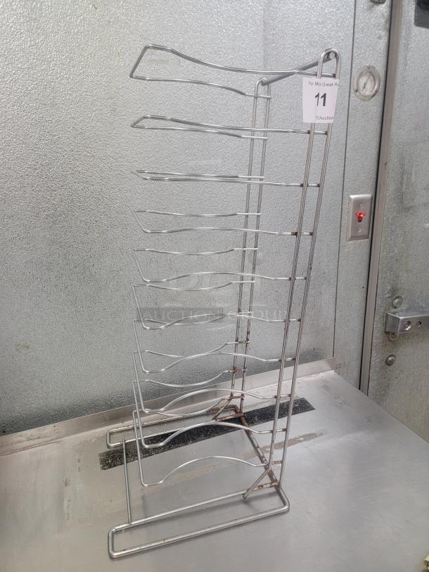 27" Heavy Duty Chrome Pizza Pan Rack - Maximize Your Pizza Output! Streamline your pizza production and storage with this robust 27-inch Heavy Duty Chrome Pizza Pan Rack, an essential piece of equipment for any pizzeria, restaurant, or high-volume kitchen that needs efficient storage and cooling for pizza pans. *BUYER MUST REMOVE - NO SHIPPING OR HANDLING AVAILABLE* - Image 1 of 1