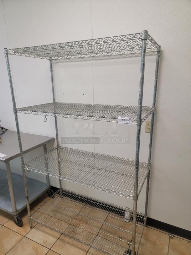 Focus NSF Metal Racking Shelves! Is your kitchen or pantry a chaotic mess? Get organized and boost your storage capacity with this fantastic rack! We're offering a 4-foot, 4-shelf  Commercial Grade Wire Rack, renowned for its durability and versatility. *BUYER MUST REMOVE - NO SHIPPING OR HANDLING AVAILABLE* - Image 1 of 2