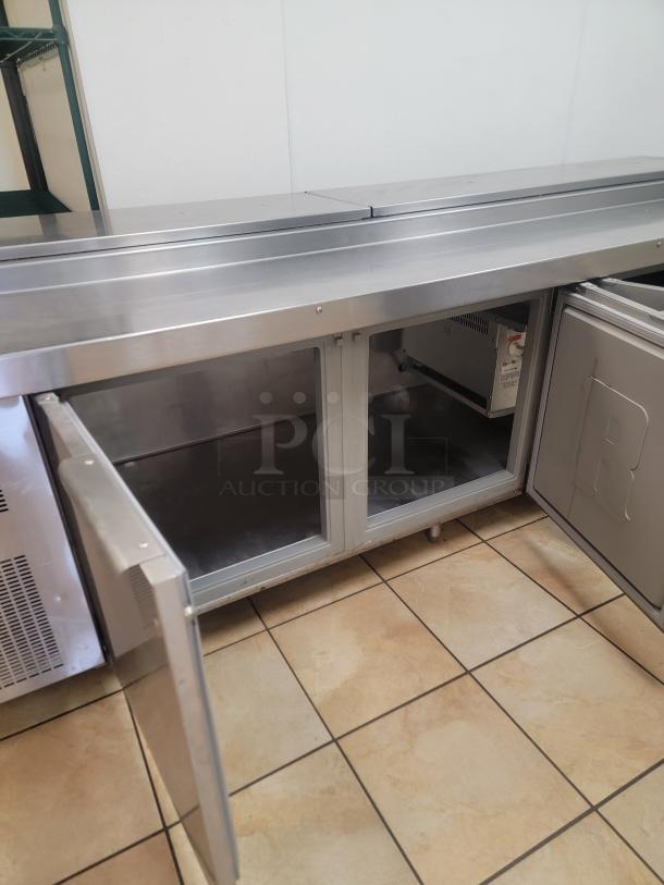 Randell 84111N-290 111" Pizza Prep Table w/ Refrigerated Base, 115v! Elevate your pizzeria's efficiency and product freshness with this massive pizza prep table! Designed for high-volume operations, this 111-inch workhorse provides ample space for preparing multiple pizzas simultaneously while keeping all your ingredients perfectly chilled and accessible. *BUYER MUST REMOVE - NO SHIPPING OR HANDLING AVAILABLE* - Image 3 of 6