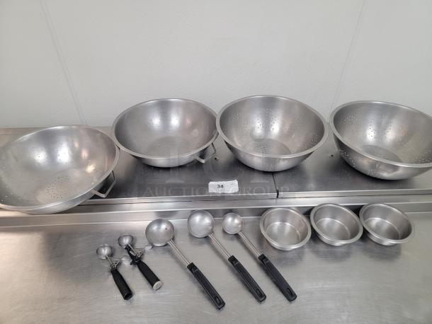 Commercial Kitchen Essentials! 4 Colanders, Spoons, & Assorted Utensils! Upgrade your kitchen's efficiency with this fantastic deal! We're offering a great package including four commercial-grade colanders, a variety of useful spoons, and assorted utensils, perfect for any busy restaurant, catering service, or even a highly active home kitchen. *BUYER MUST REMOVE - NO SHIPPING OR HANDLING AVAILABLE* - Image 1 of 1