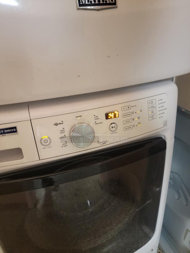 Maytag Electric Stackable Washer & Dryer Set - Efficient & Space-Saving! Fantastic Maytag electric stackable washer and dryer set, perfect for maximizing space in your laundry area! This reliable duo offers powerful cleaning and drying performance in a compact footprint. *BUYER MUST REMOVE - NO SHIPPING OR HANDLING AVAILABLE* - Image 6 of 7