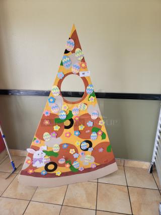 Giant Pizza Slice Photo Booth Prop / Selfie Frame - Easter/Spring Theme! The large cutout in the center of the "pizza slice" allows individuals to stand behind it and place their faces within the opening, creating a fun photo opportunity, similar to a selfie frame or a photo booth prop. *BUYER MUST REMOVE - NO SHIPPING OR HANDLING AVAILABLE*