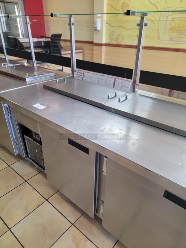 Wasserstrom 21-Foot Refrigerated Prep Table with Cold Food Wells - Massive Capacity! Revolutionize your kitchen's prep and cold storage! We're offering an impressive 21-foot Refrigerated Prep Table with integrated Cold Food Wells, the ultimate solution for high-volume sandwich, salad, pizza, or assembly lines. This is a must-have for large restaurants, delis, catering operations, or institutional kitchens that demand efficiency and ample refrigerated storage. See Video in Description Below 👇*BUYER MUST REMOVE - NO SHIPPING OR HANDLING AVAILABLE* - Image 4 of 9