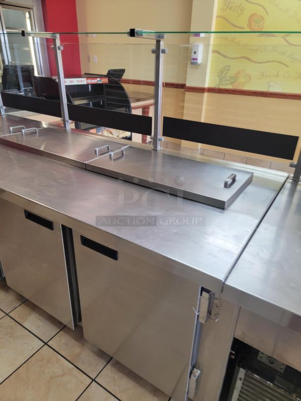Wasserstrom 21-Foot Refrigerated Prep Table with Cold Food Wells - Massive Capacity! Revolutionize your kitchen's prep and cold storage! We're offering an impressive 21-foot Refrigerated Prep Table with integrated Cold Food Wells, the ultimate solution for high-volume sandwich, salad, pizza, or assembly lines. This is a must-have for large restaurants, delis, catering operations, or institutional kitchens that demand efficiency and ample refrigerated storage. See Video in Description Below 👇*BUYER MUST REMOVE - NO SHIPPING OR HANDLING AVAILABLE* - Image 5 of 9