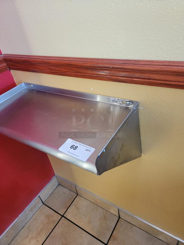 2' Advance Tabco stainless steel wall shelf, model WS-KD-24. Durable, hygienic, ideal for storage. Label: PCAuctions.com.