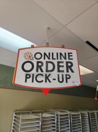 5' x 32" 'Online Order Pick Up' Sign - Direct Your Digital Customers! Guide your online customers seamlessly with this prominent 5-foot by 32-inch 'Online Order Pick Up' Sign, perfect for businesses with takeout, curbside, or in-store pickup services. This large, highly visible sign ensures your digital customers know exactly where to go to retrieve their orders, making their experience smooth and efficient. *BUYER MUST REMOVE - NO SHIPPING OR HANDLING AVAILABLE*