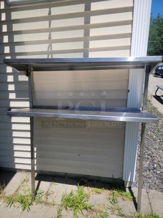 Stainless steel double over shelf, 4'x16", adjustable to 5' tall, ideal for kitchen or workshop storage.