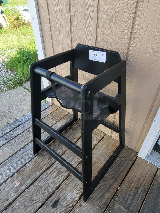 Lancaster Table and Seating wooden high chair, sturdy build, black finish, suitable for restaurants. Tag reads "45 QTY." Ideal for commercial use.