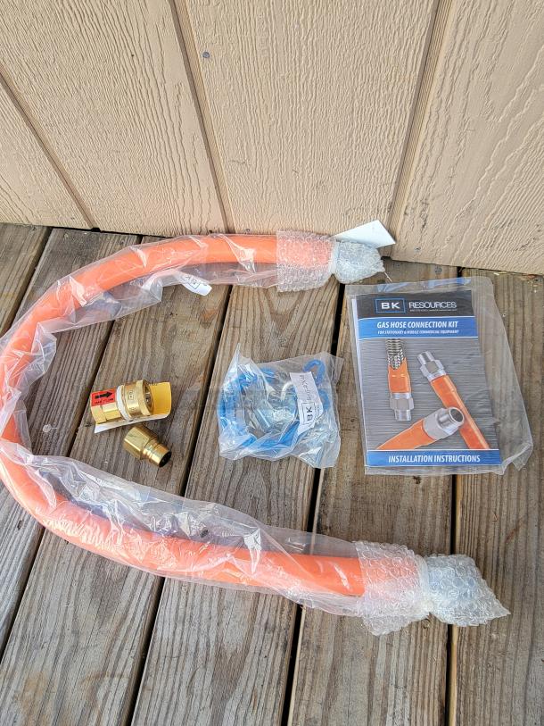 BK Resources Gas Hose Connection Kit, 3/4 x 48", new in packaging, includes hose, fittings, and installation instructions.