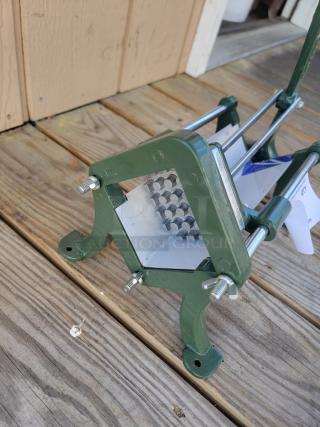 True Craftware heavy-duty French fry cutter; metal frame, robust design, ideal for fresh-cut fries, sturdy condition.