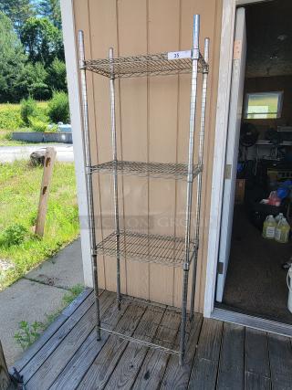 Versatile 2' x 14" x 6' NSF chrome wire shelving unit with three shelves, ideal for storage. Sturdy and in good condition.