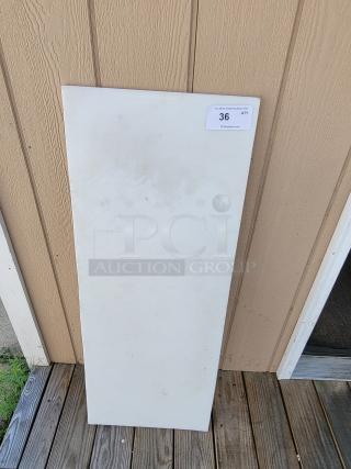 Large 44" x 17" commercial grade cutting board, white, used condition, label marked "36", ideal for kitchens and bakeries.