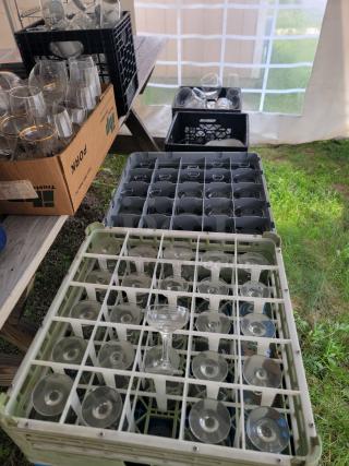 Huge assorted glassware lot in crates; variety of glass types for collection, kitchen use, crafts, or decor. Excellent condition.