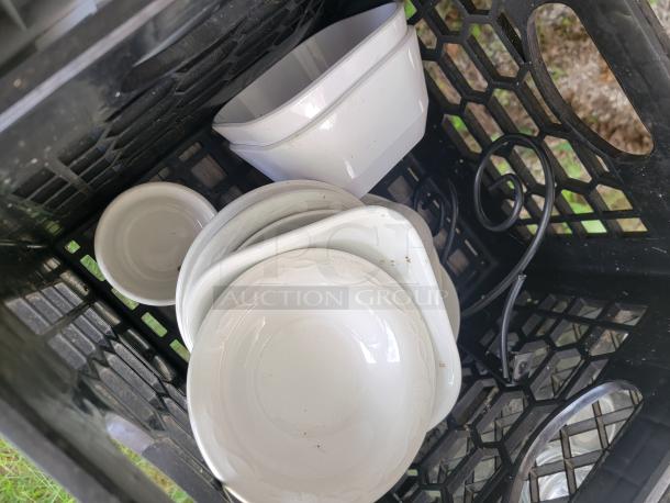 Assorted glassware in crate, various shapes and sizes, ideal for collection or decor. Good condition, some minor signs of wear.