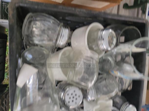 Assorted glassware lot, featuring various shapes and sizes, ideal for collection or decor. Some pieces have metal lids.