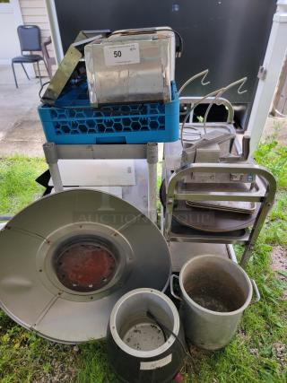 Assorted commercial kitchen lot with toasters, bakeware, pots, trays, vegetable slicer, and banana holders. Visible label indicates quantity 50.