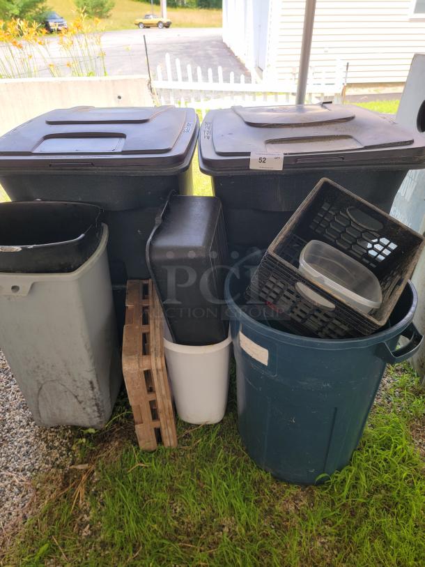 Rubbermaid 96-gallon toter bins, storage containers, and miscellaneous garage items. Ideal for organization and use.
