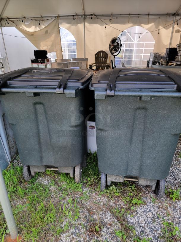 Rubbermaid 96 Gallon Toter Bins in good condition with lids and wheels, ideal for garage or workshop storage.